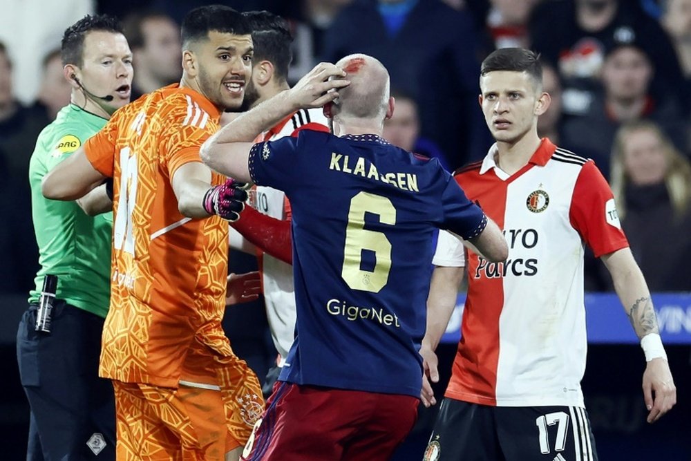 The Dutch cup semi-final was interrupted when a lighter thrown from the stands hit Klaassen. AFP