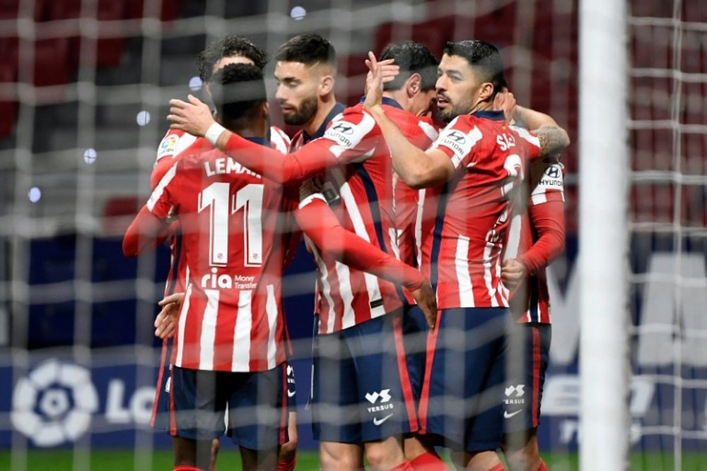 Atletico Madrid players celebrate one of their goals in a win over Valencia in La Liga. AFP