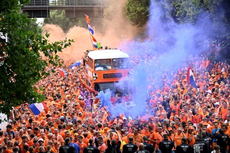 Dutch fans cheer in the streets of Dortmund ahead of Netherlands Euro 2024 semi-final. AFP