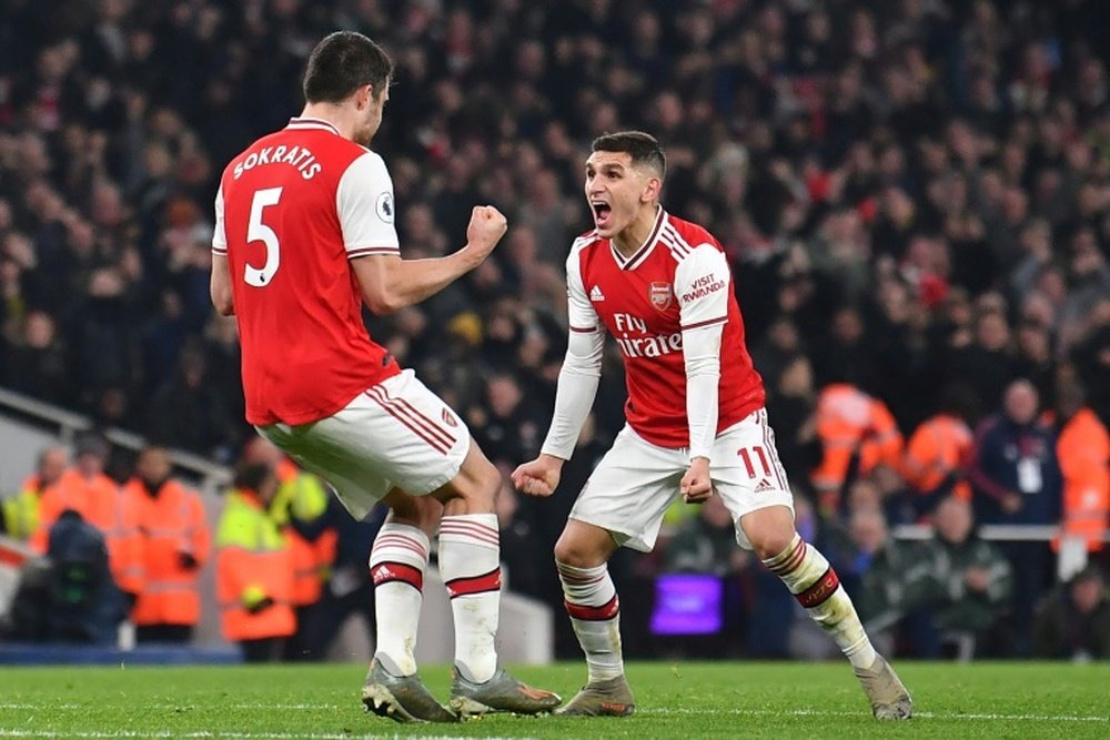 Sokratis (L) scored the second in Arsenal's victory over Man Utd. AFP
