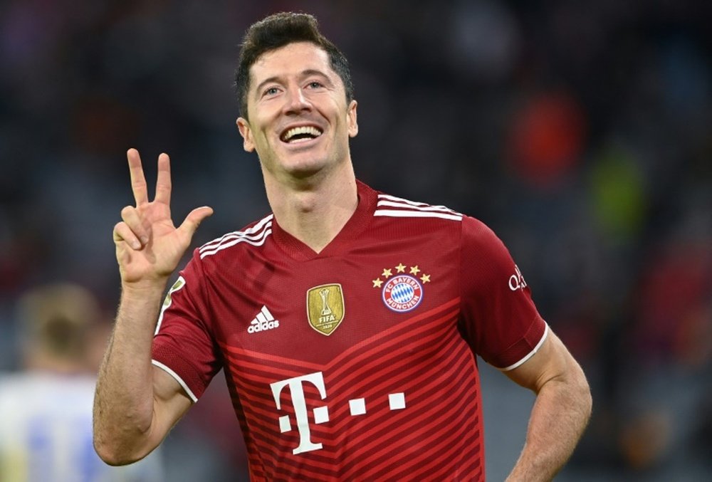 Lewandowski celebrates his hat-trick as Bayern Munich thrashed Hertha Berlin 5-0 on Saturday. AFP