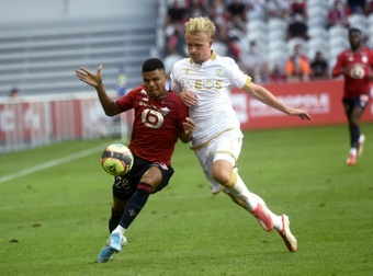 Kasper Dolberg (R) scored twice as Nice thumped Lille 0-4. AFP
