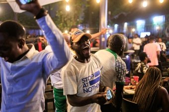 Afrobeats tunes competing with cheers, Nigerians celebrated a tense penalty victory over South Africa on Wednesday night as their team advanced to the Africa Cup of Nations finals after a scrappy semi-final match.