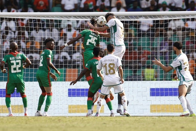 Bounedjah (C) scored his second equaliser for Algeria in an Africa Cup of Nations draw. AFP