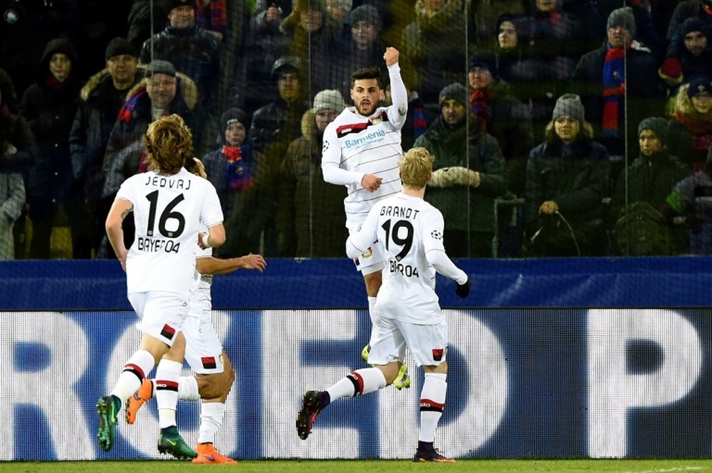 Leverkusen players celebrate opening the scoring. AFP
