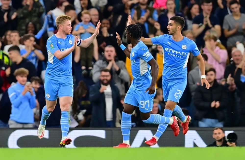 Manchester City midfielder Kevin De Bruyne celebrates scoring against Wycombe. AFP