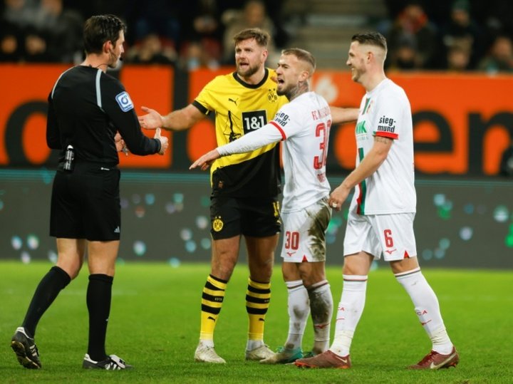 Dortmund's poor run continues with draw at Augsburg