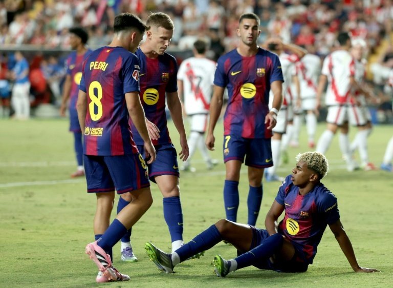 Le Barça est à deux points du duo de tête après un match nul 1-1 à Rayo. AFP