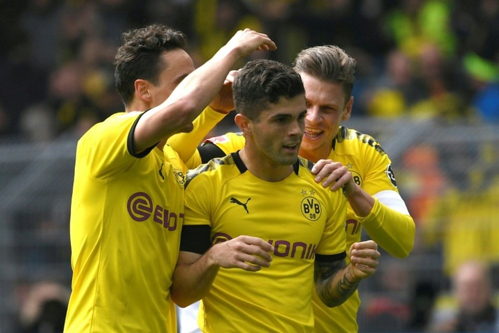 Dortmund took the title race to the wire after beating Duesseldorf. AFP