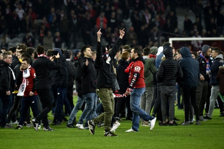 Lille pitch invasions lead to ten arrests