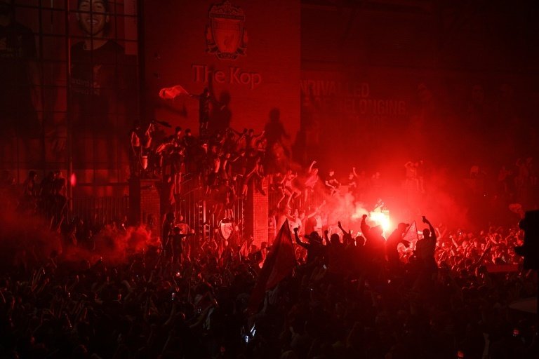 Police rebuke Liverpool fans after Premier League street party. AFP
