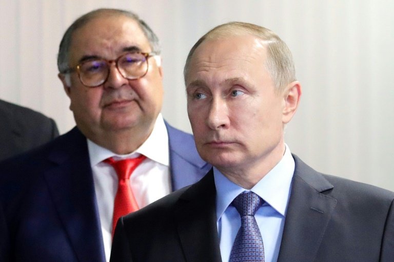 Everton suspend Usmanov's (L) sponsorship agreements. AFP