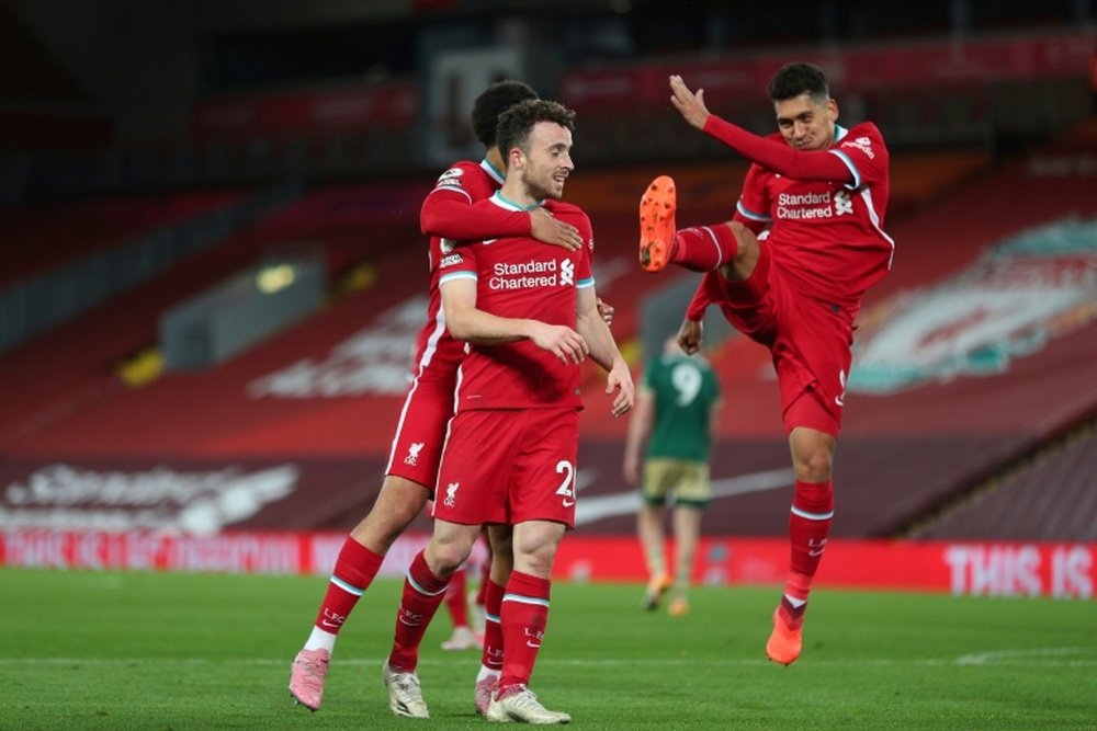 Liverpools Diogo Jota (C) celebrates scoring against Sheffield United. AFP