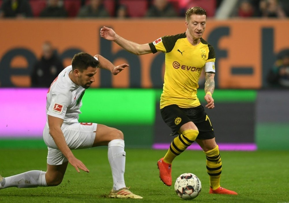 Sporting director believes Reus will end career at Dortmund. AFP