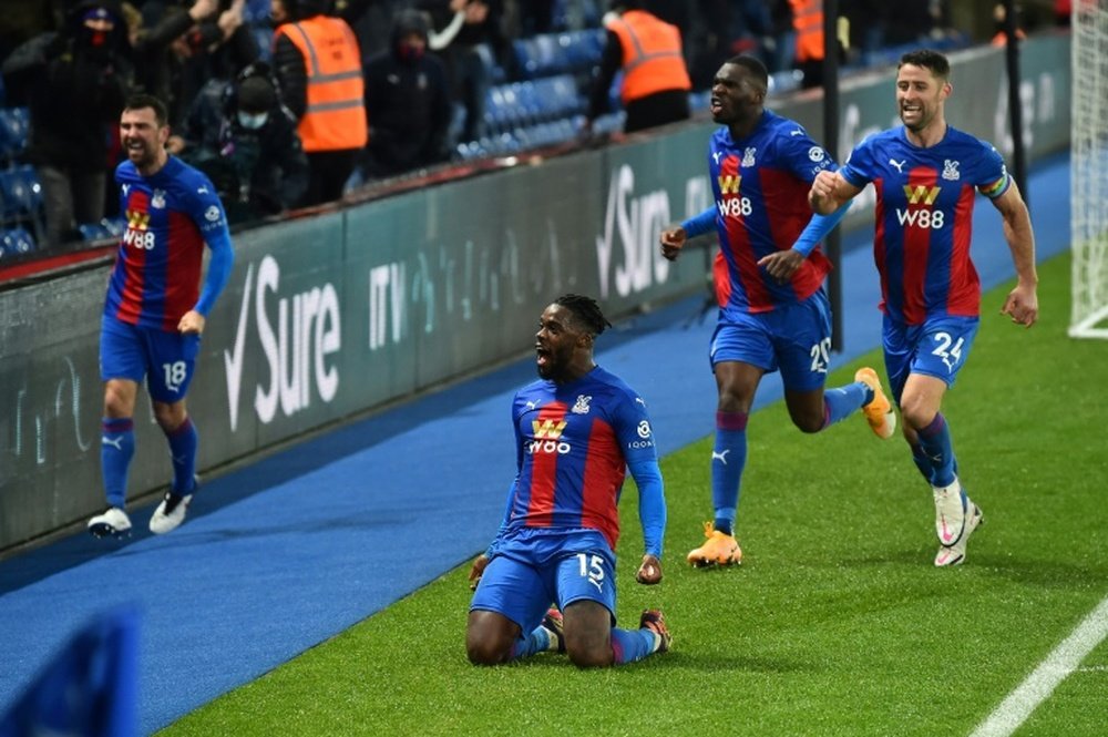 Jeffrey Schlupp celebrates after securing a 1-1 draw for Crystal Palace against Tottenham. AFP