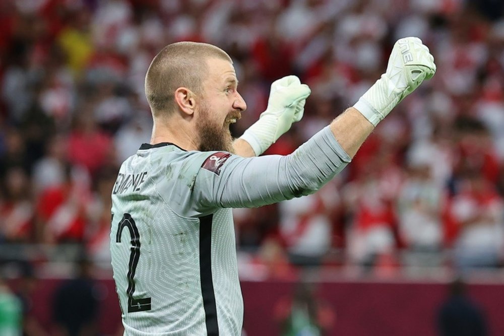 Goalkeeper Andrew Redmayne celebrates Australias victory in Doha. AFP