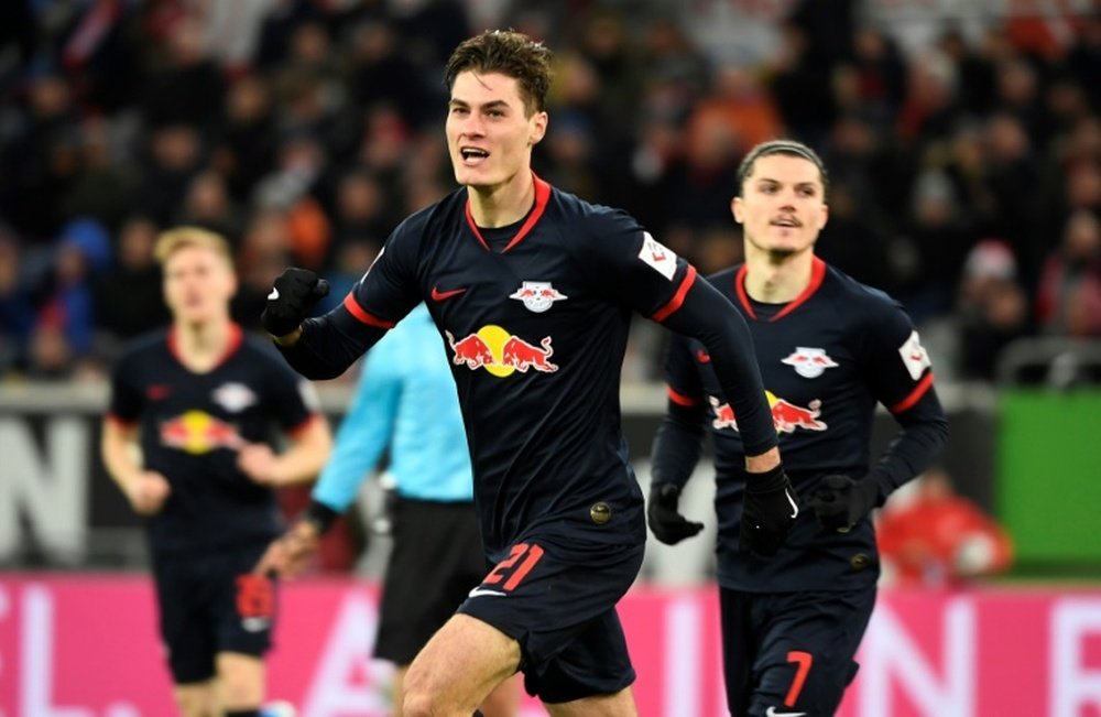 Schick salvages point for leaders Leipzig in Dortmund thriller. AFP