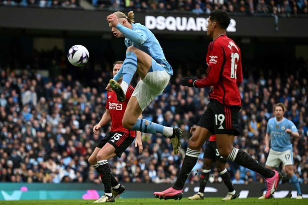 Haaland (C) bounced back from missing a glorious chance to score against United. AFP