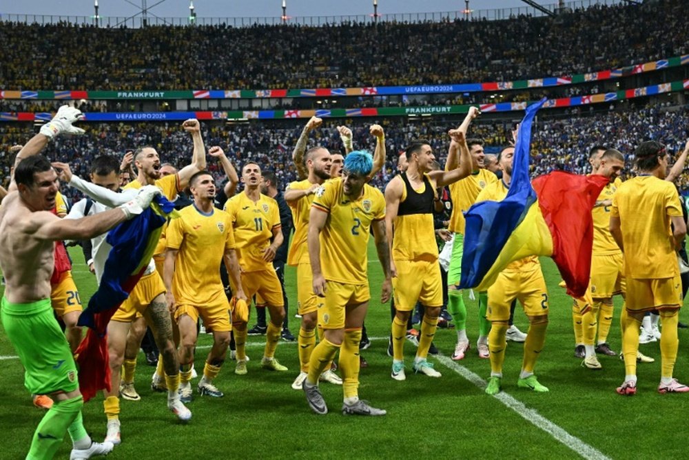 Romania celebrated qualifying for the Euro 2024 last 16. AFP