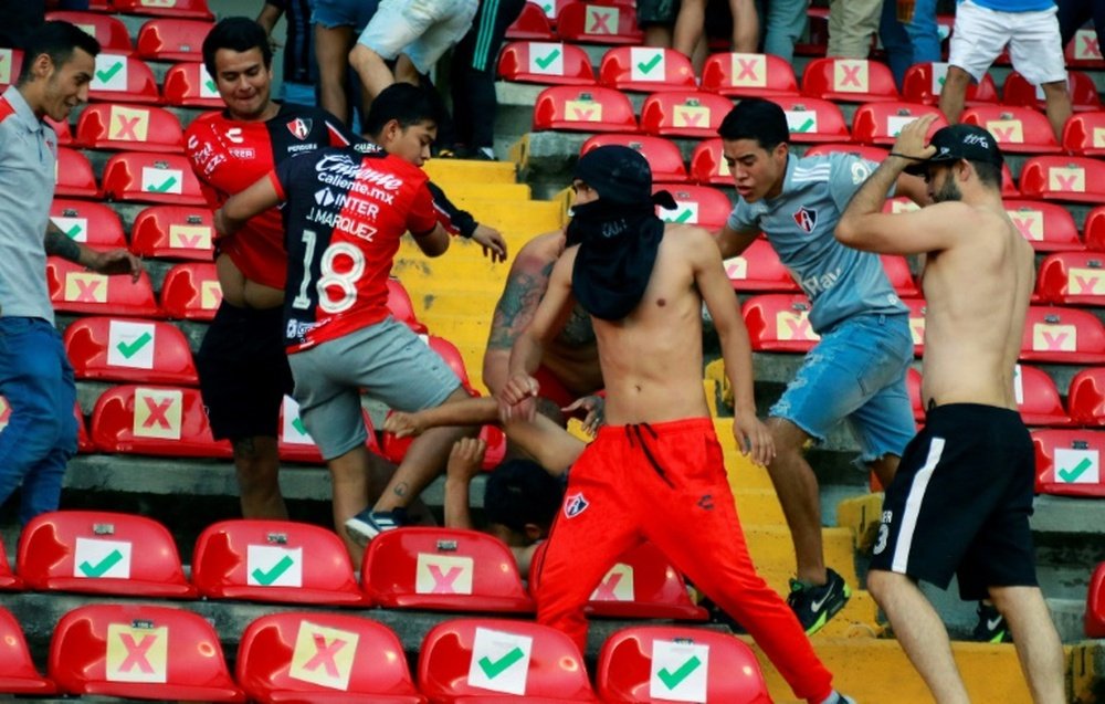 Dozens injured as fans clash at Mexico football match. AFP