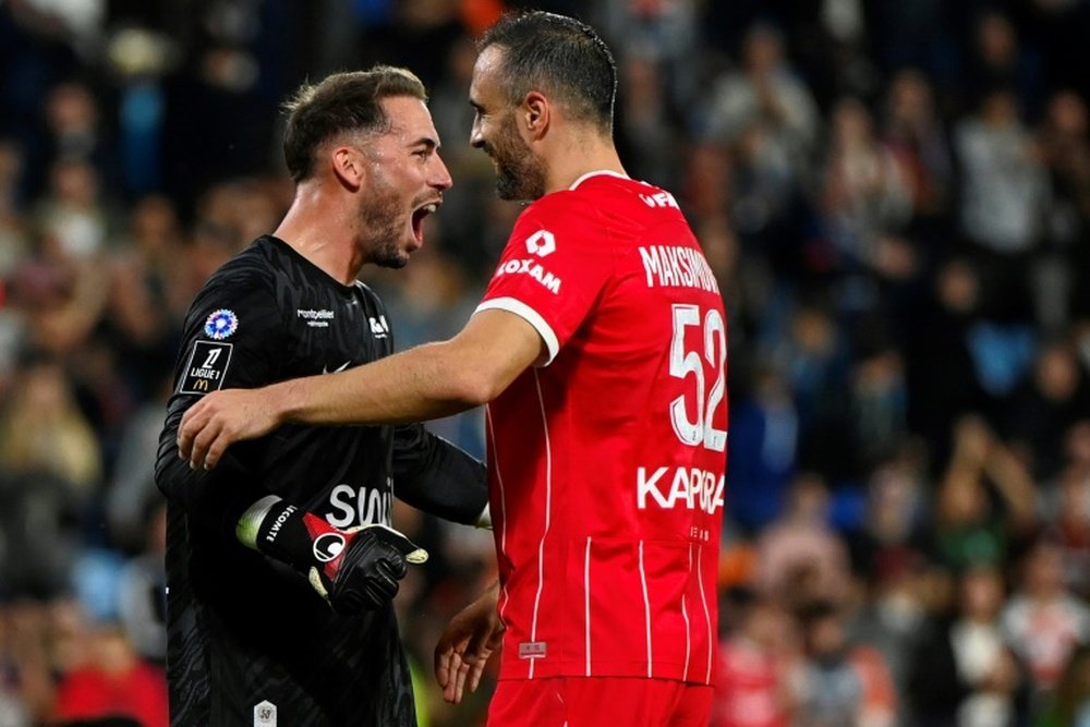 Le gardien et le défenseur de Montpellier Lecomte et Nikola Maksimovic. AFP