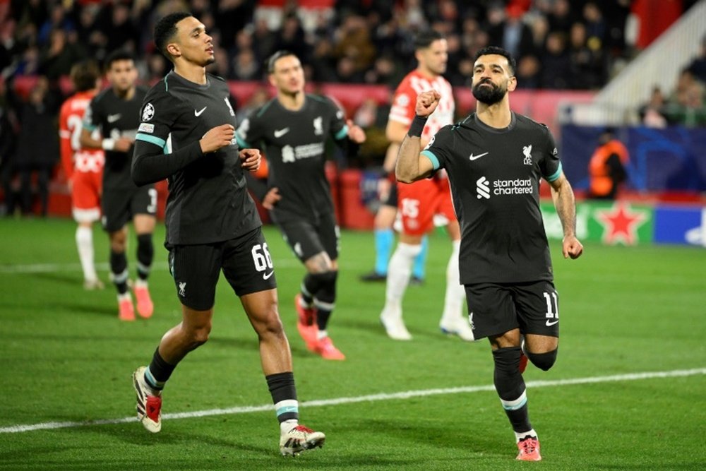 L'attaquant égyptien de Liverpool Mohamed Salah (à droite) après avoir marqué un pénalty. AFP