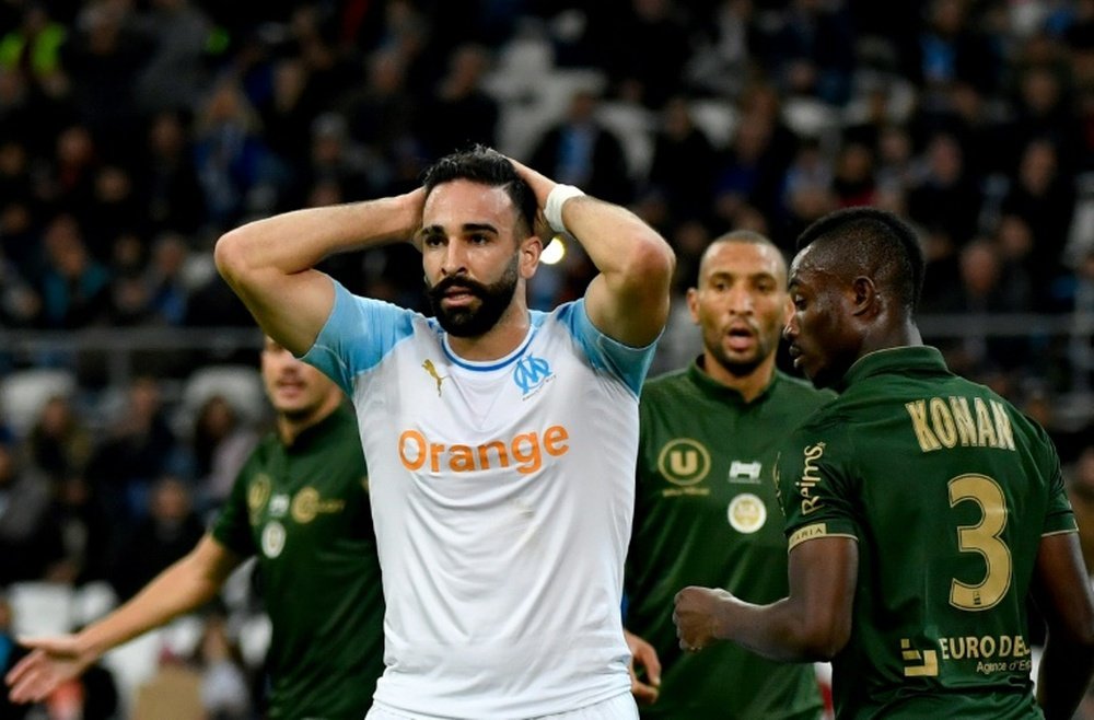 Adil Rami dépité après avoir raté un but lors du match contre Reims. AFP