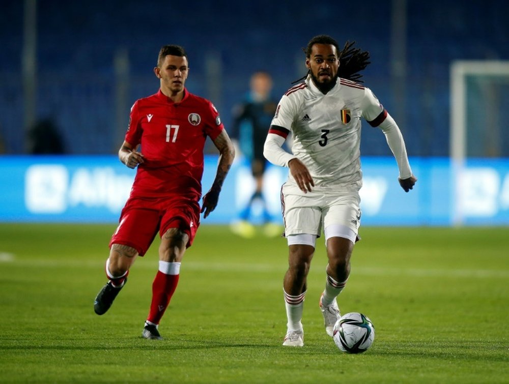 Jason Denayer (d) lors de la rencontre comptant pour les qualifications au mondial 2022. AFP