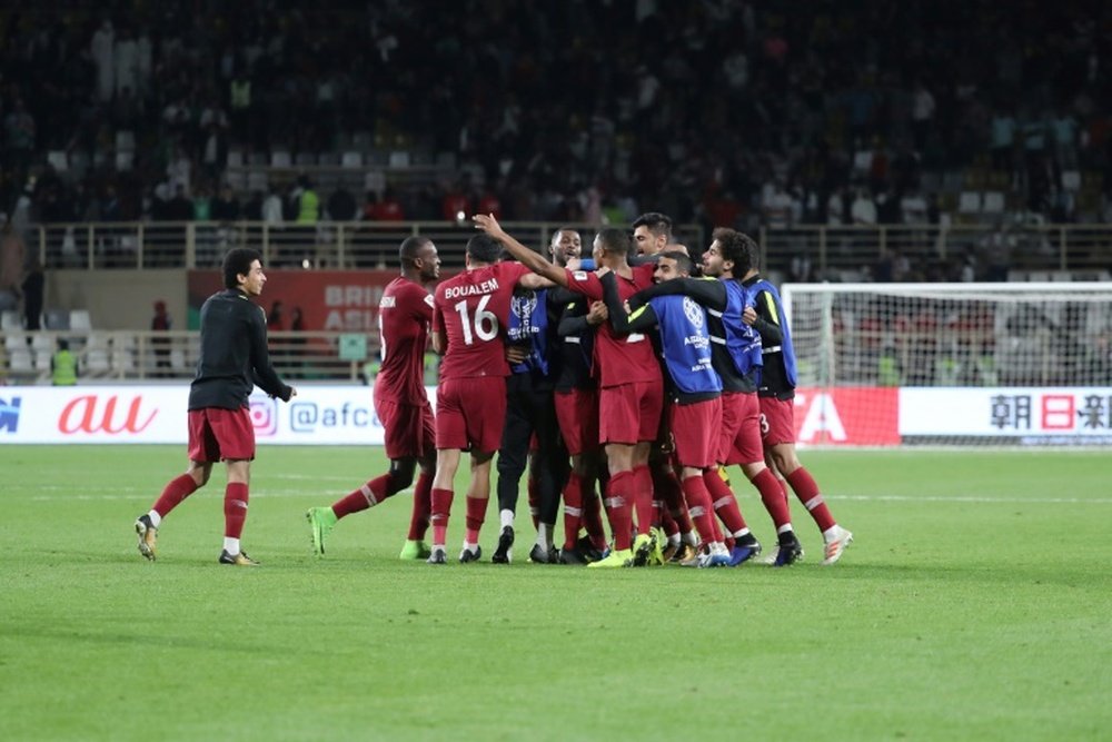 Les joueurs du Qatar fêtent leur qualification pour les quarts de finale. AFP