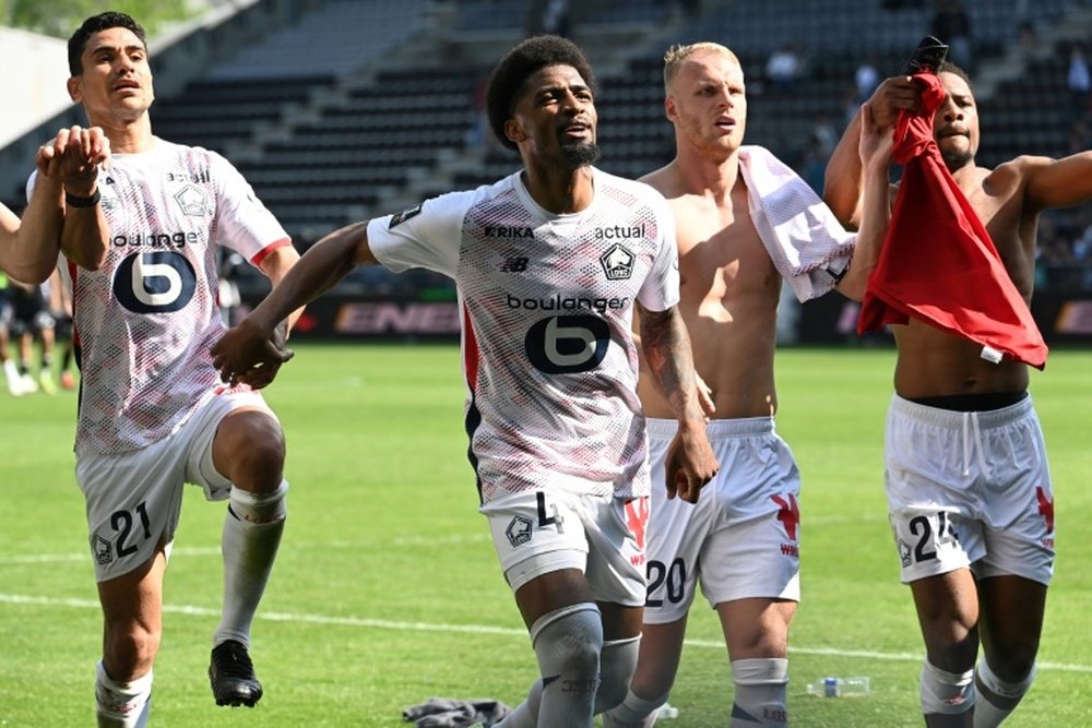 Les Lillois Benjamin Andre (gauche), Alexsandro, Mitchel Bakker et Chuba Akpom (droite). AFP