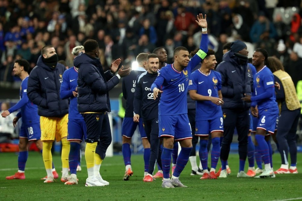La joie des Bleus et notamment de Mbappé (5d) après leur victoire aux tirs au but. AFP