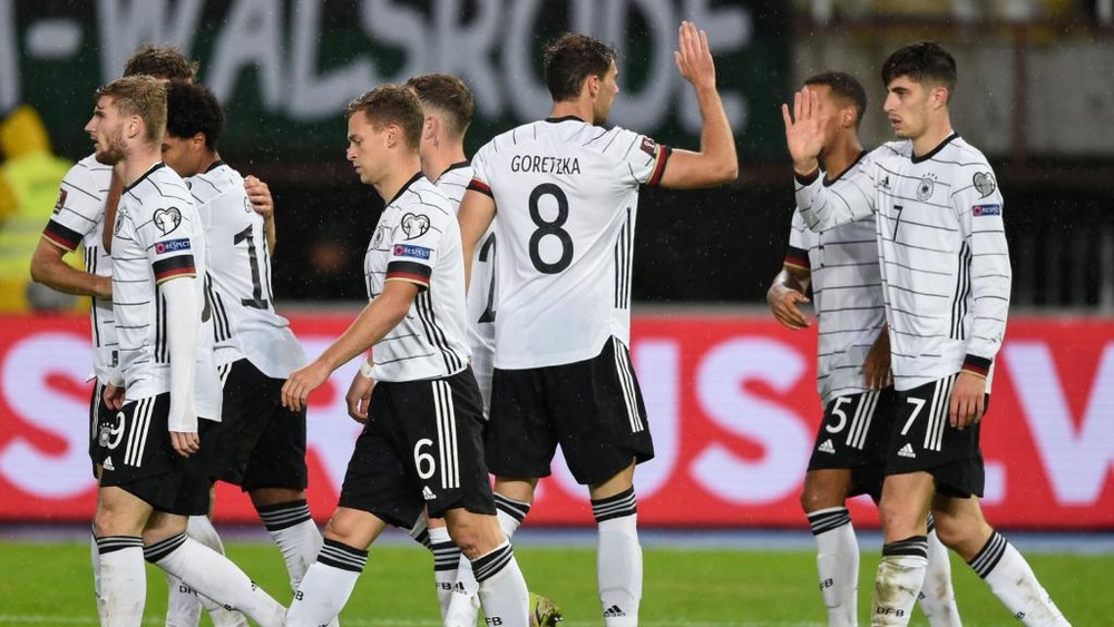 Flick hails 'perfect' result after victory over North Macedonia seals World Cup spot.
