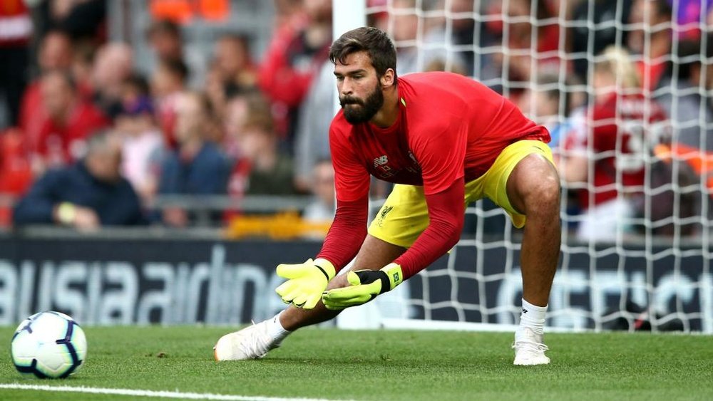 Alisson is looking to emulate Salah's success at Liverpool. GOAL