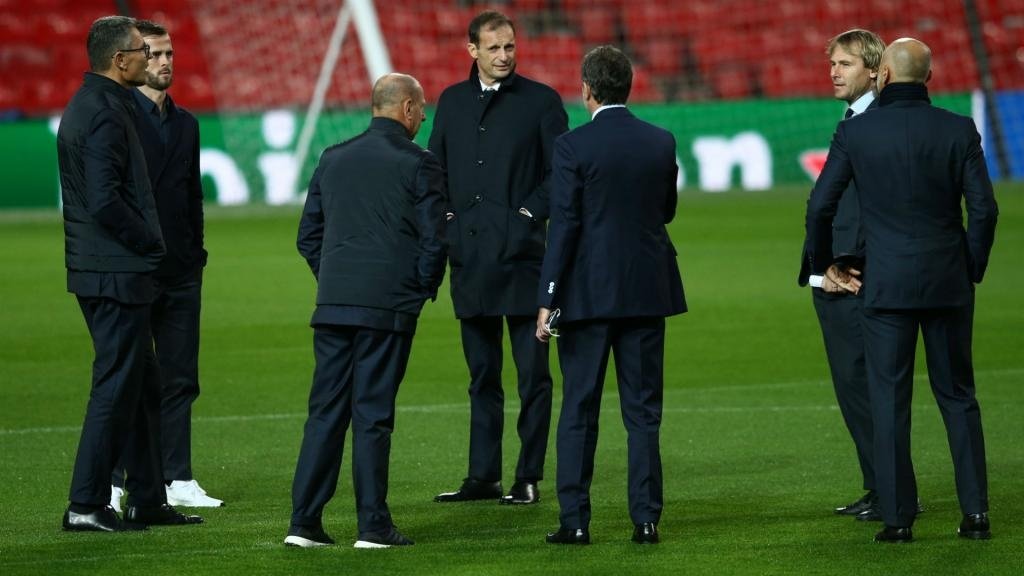 Allegri and his backroom staff pictured on the Old Trafford pitch. GOAL