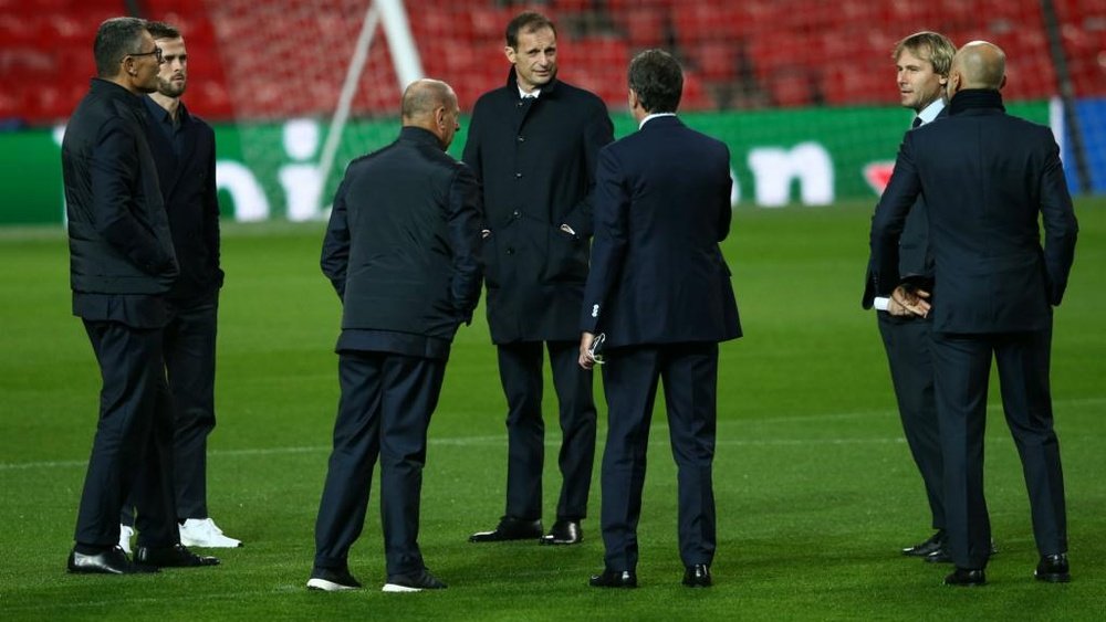 Allegri and his backroom staff pictured on the Old Trafford pitch. GOAL