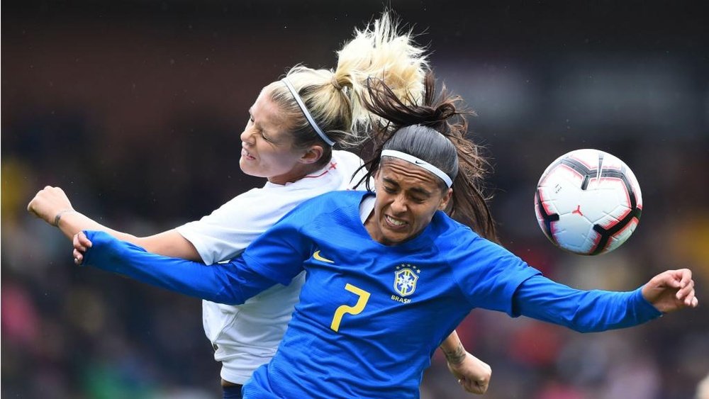 Andressa Alves (r) will miss the rest of the Women's World Cup. GOAL