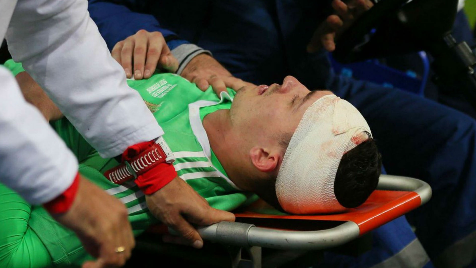Russia goalkeeper Lunev 'okay' after heavy head knock