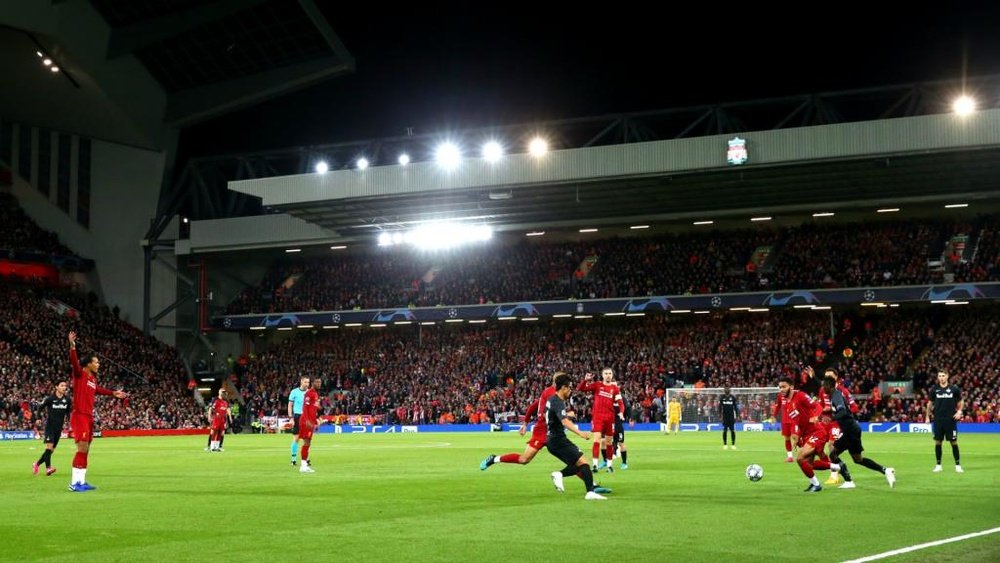 Liverpool charged by UEFA over Anfield pitch invasions. GOAL