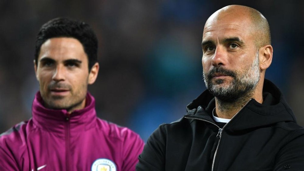 Guardiola with assistant Mikel Arteta. GOAL