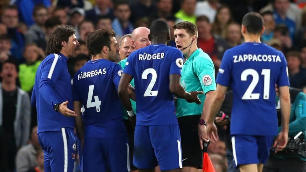 Chelsea were charged for surrounding the referee. GOAL