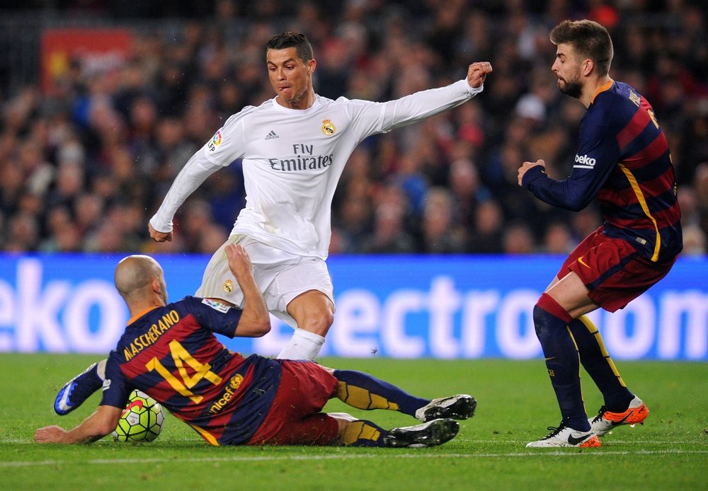Ronaldo takes on the Barcelona defence in one of the Clasicos last season. Goal