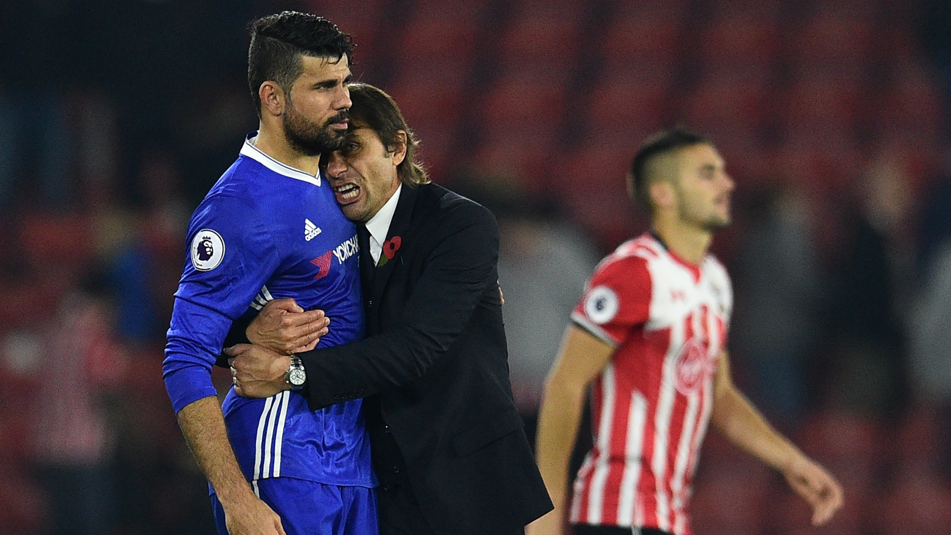 Diego Costa and Antonio Conte hugging. Goal