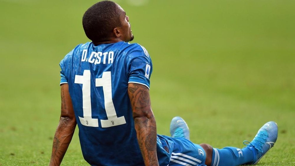 Douglas Costa will miss the trip to Madrid to face Atletico. GOAL