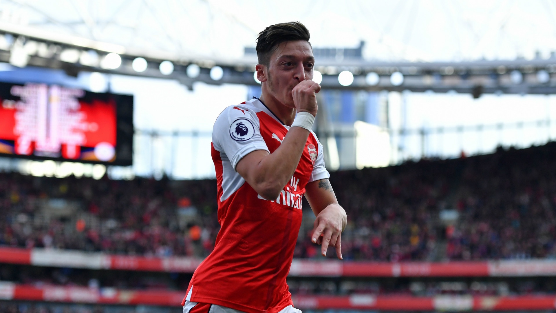 Ozil celebrates scoring for Arsenal. Goal