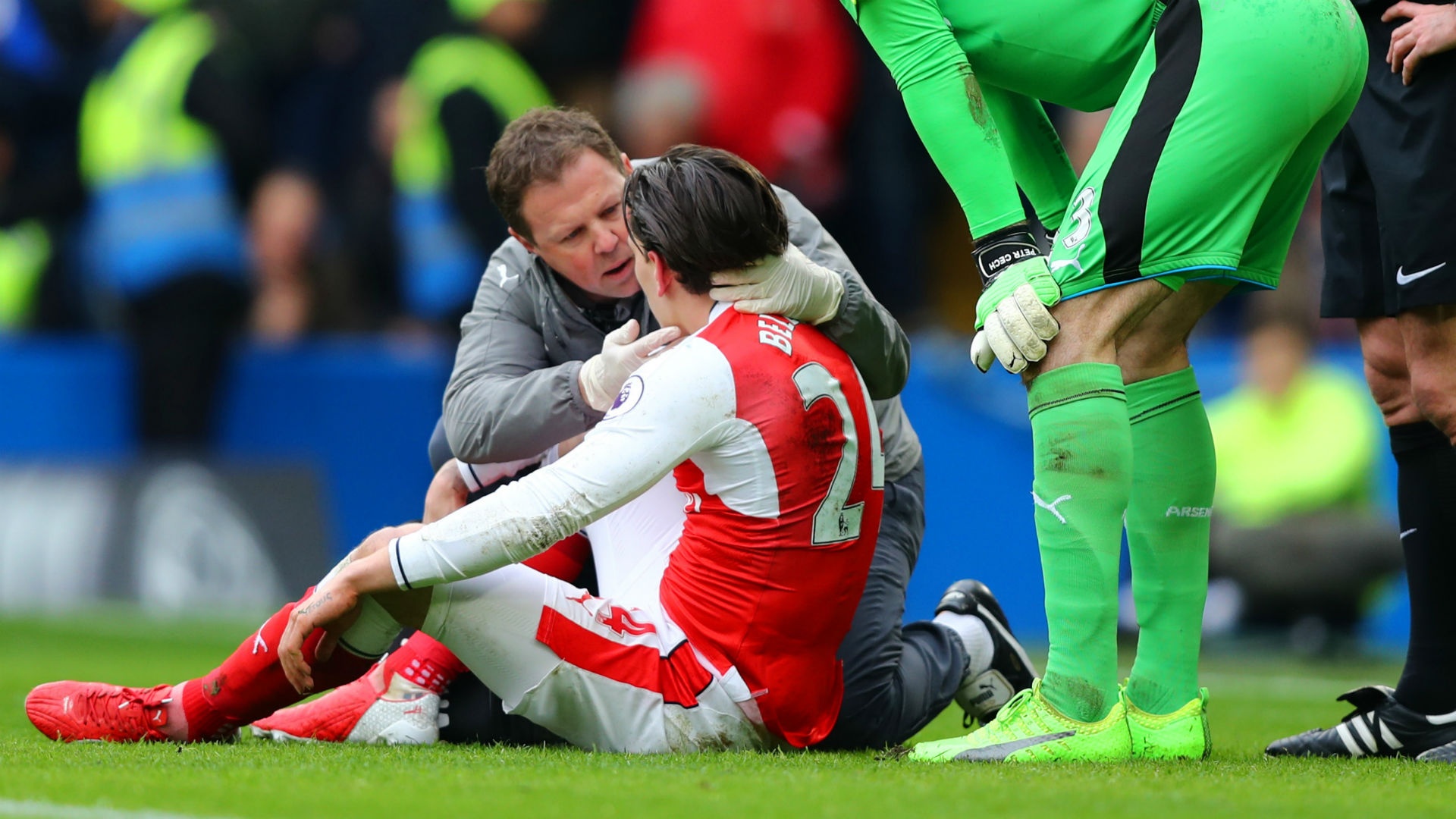 Hector Bellerin moments after clashing heads with Marcos Alonso. Goal