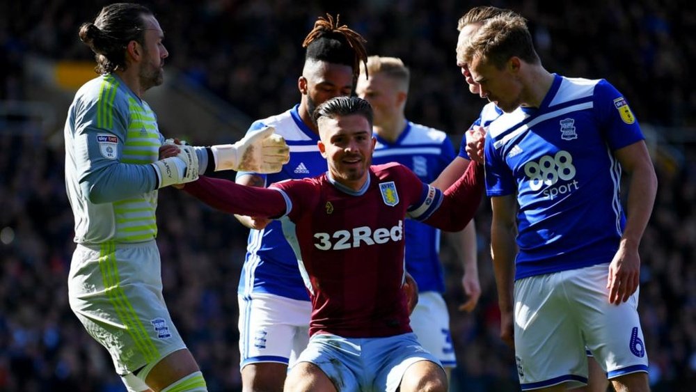 Jack Grealish was brutally floored by a pitch invader. GOAL