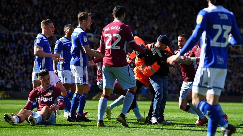 Grealish was punched by a pitch invader. GOAL