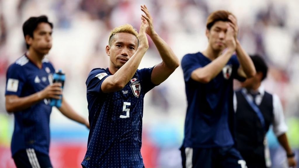 Japan celebrate their qualification to the round of 16. GOAL