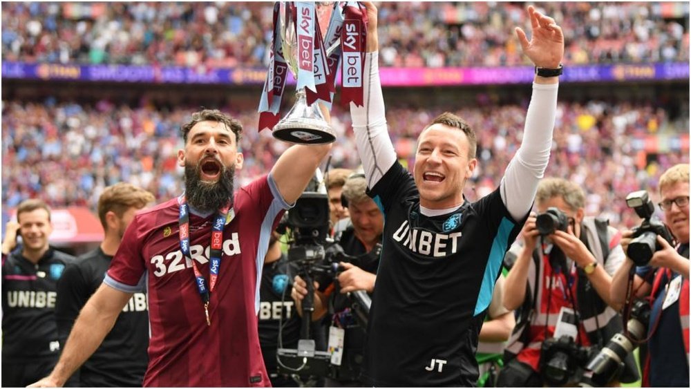 Mile Jedinak and John Terry with the SKy Bet Play-Off trophy at Wembley, GOAL