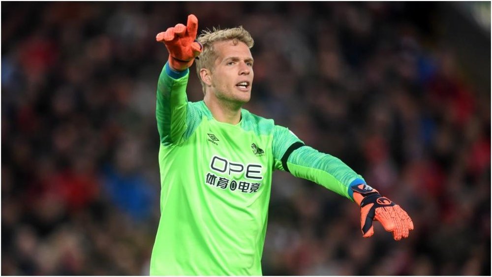 Jonas Lossl is heading to Everton. GOAL